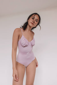 one-piece lilac swimsuit with ruched top and belt detail